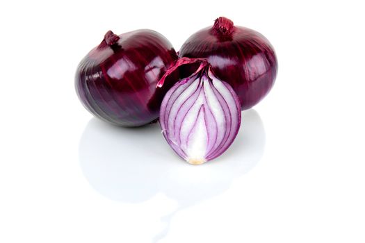 Red onion and half slice on white background with reflect.