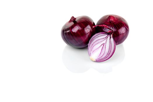 Red onion and half slice on white background with reflect.