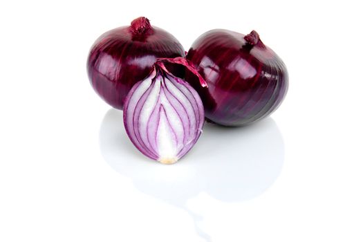 Red onion and half slice on white background with reflect.