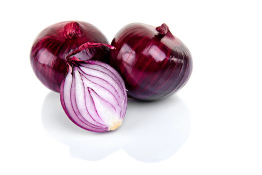 Red onion and half slice on white background with reflect.