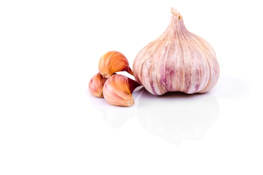 Garlic isolated on white background with reflection.