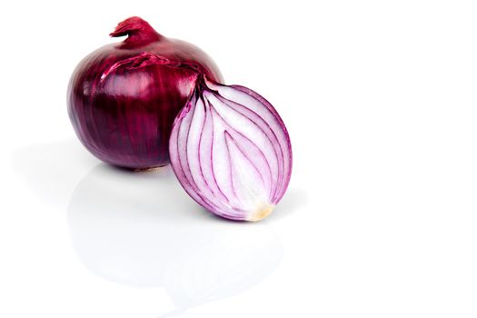 Red onion and half slice on white isolated background with reflect.