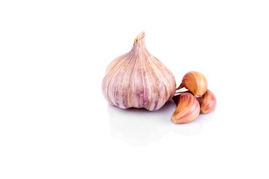 Garlic isolated on white background with reflection.