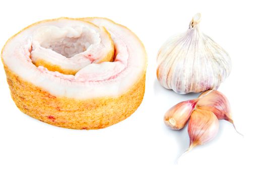 Pork belly with garlic isolated on a white background.