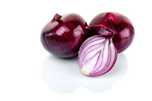 Red onion and half slice on white background with reflect.