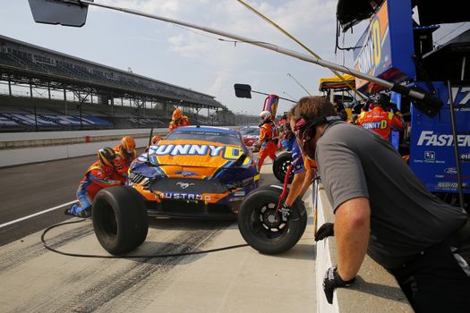 Chris Buescher (17) makes a pit stop for the Big Machine Hand Sanitizer 400 Powered by Big Machine Records at Indianapolis Motor Speedway in Indianapolis, .