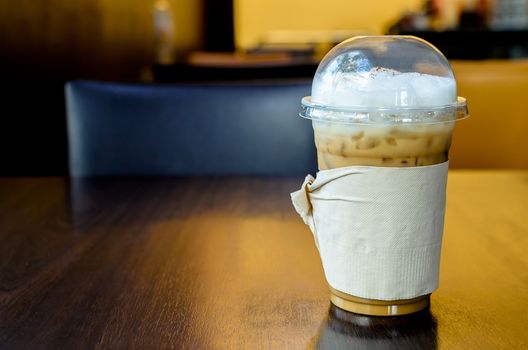 Iced Cappuccino on the wood table in coffee shop restaurant has ready to served.