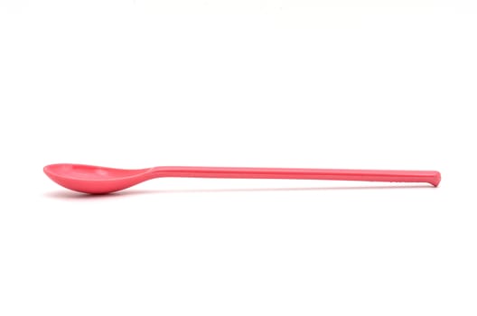 A Pink Spoon isolated on white backgroud.