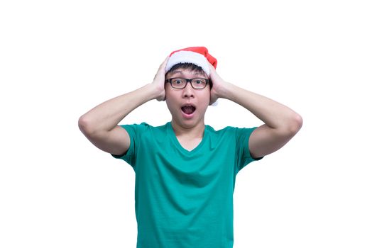 Asian Santa Claus man with eyeglasses and green shirt has feeling like a really surprise and shock isolated on white background with copy space.