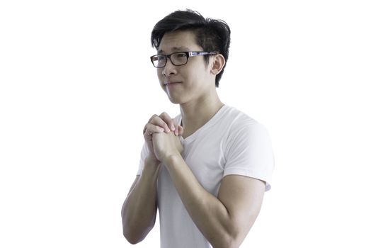 Asian handsome man with white shirt and orange eyeglasses has plead and appeal for luck isolated on white background and clipping paths.