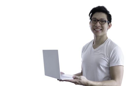 Asian handsome man with white shirt and orange eyeglasses has smile and happy when holding and working with computer laptop for goal and successful isolated on white background and clipping paths.