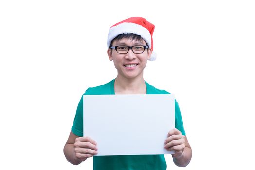 Asian Santa Claus man with eyeglasses and green shirt has holding a white blank advertisement banner isolated on white background with copy space.