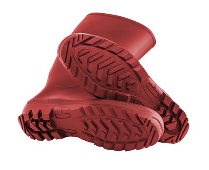 a pair of clean and new red rubber boots isolated on white background.