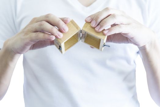 Man has give a surprise present with empty wooden treasure. Selective focus and isolated and white background concept.