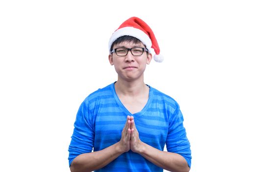 Asian Santa Claus man with eyeglasses and blue shirt has plead and appeal for luck isolated on white background with copy space.