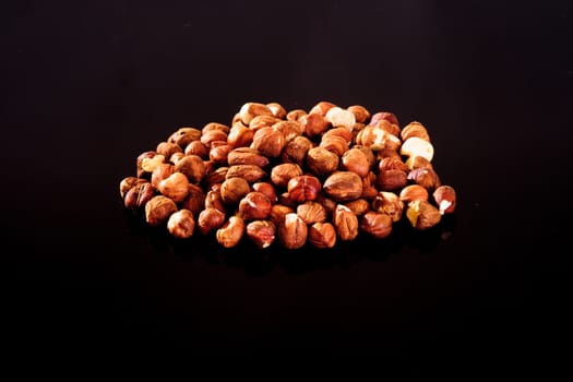 Hazelnuts on a black background