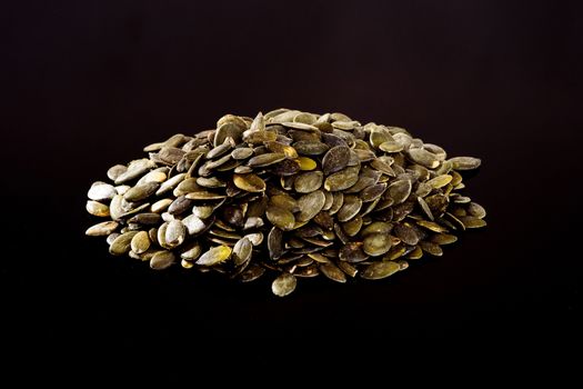 Pumpkin Seeds on a black background