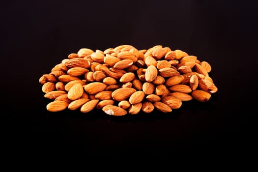 Raw Almonds on a black background