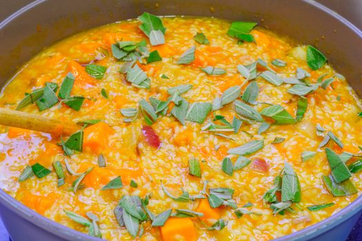 Risotto, an Italian rice dish, made with pumpkin and sage