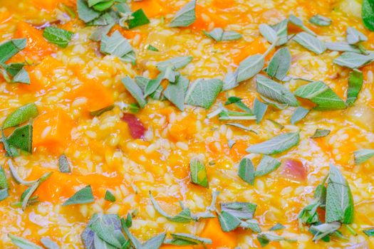 Risotto, an Italian rice dish, made with pumpkin and sage