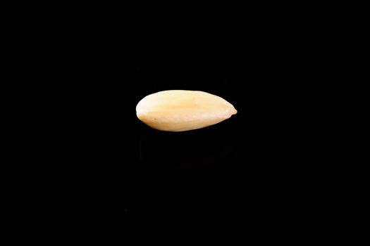 Blanched Almond on a black background