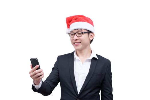 Business man has mobile playing with Christmas festival themes isolated on white background.