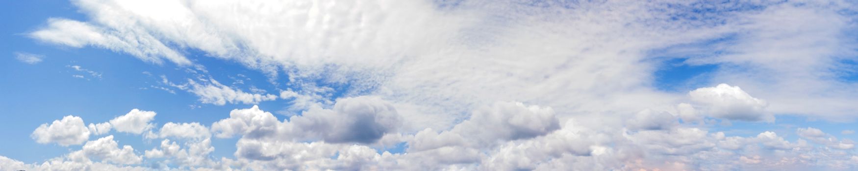 Vibrant color panoramic sky with cloud on a sunny day. Beautiful cirrus cloud. Panorama high resolution photograph.