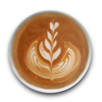 Top view of a mug of latte art coffee isolted on white background.