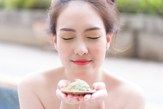 Portrait of beautiful asian people with close up view and close up eyes and feeling good smelling for cream. Beauty, healthy, spa and relaxation concept.