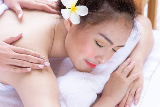 Portrait of beautiful asian people with close up view and close up eyes and having hand massage in spa salon. Beauty, healthy, spa and relaxation concept.