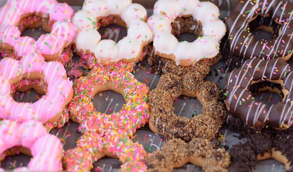 Set of colorful and delicious donut in paper box