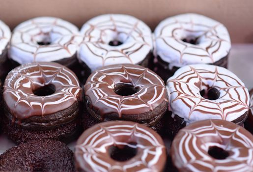 Set of colorful and delicious donut in paper box