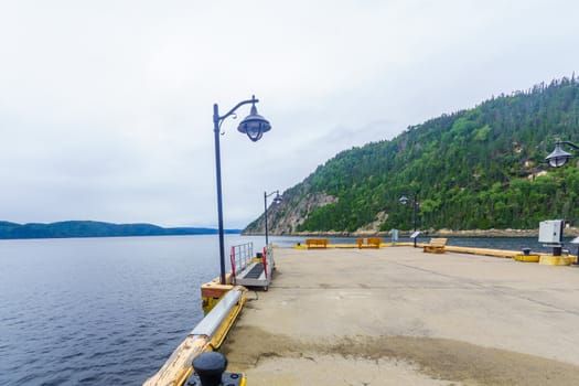 Pier and landscape of the Saguenay Fjord in Sainte-Rose-du-Nord, Quebec, Canada