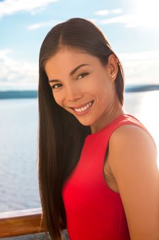 Beautiful Asian elegant woman smiling beauty portrait Happy multiracial lady outside on terrace. Young professional confident businesswoman.