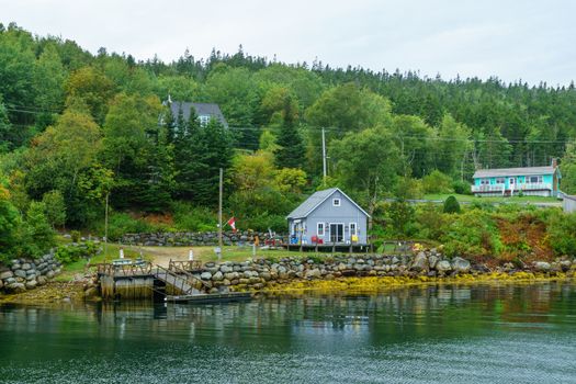 Views of the bay, boats and waterfront buildings in the fishing village Aspotogan, Nova Scotia, Canada