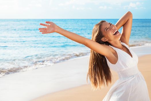 Freedom woman on beach enjoying life with open arms feeling free bliss and success on beach. Happiness Asian girl in white summer dress enjoying ocean nature sunset during travel holidays vacation.