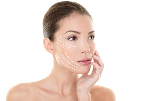 Face lift treatment anti aging skincare beauty woman concept. Skin care Asian model touching face with lifting arrows lines facelift design. Portrait in studio isolated on white background.