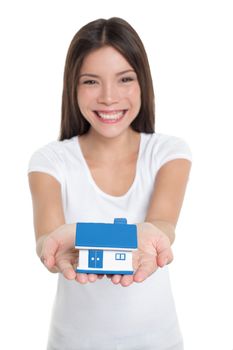 Homeowner buying first house happy Asian woman holding hands real estate house smiling showing miniature toy for home insurance protection concept.