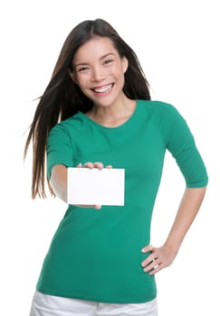 Happy young casual Asian woman holding blank sign showing business card for text advertisement.
