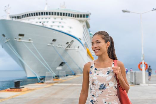 Cruise ship passenger leaving boat for shore excursion in harbour. Asian woman tourist spending a day in port of call of Caribbean travel destination.