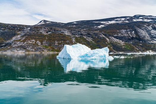 Photo of Iceberg and ice from glacier in arctic nature landscape on Greenland. Icebergs in Ilulissat icefjord. Affected by climate change and global warming.