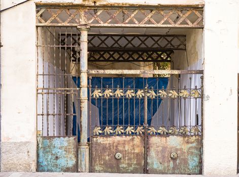 Closed vintage rusty metal gate 