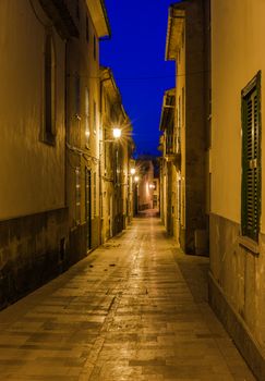 Night view of a street in old town Alcudia on Mallorca island, Spain