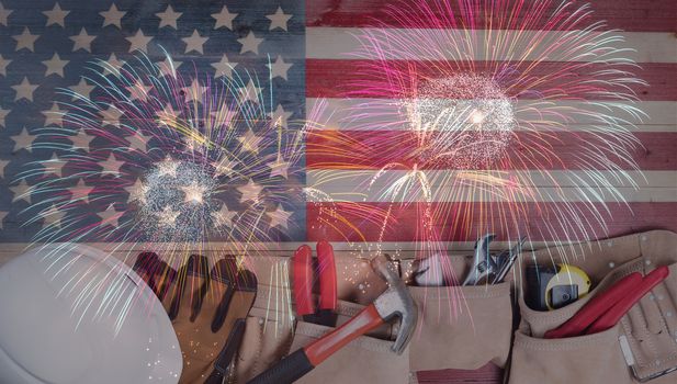 Labor Day background with hand tools and fireworks for the holiday celebration 