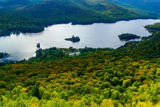 View of La Roche observation point, Monroe Lake and the park, with fall foliage colors in Mont Tremblant National Park, Quebec, Canada