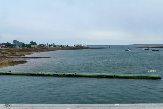 View of Saint Andrews coast, waterfront and lighthouse at low tide. New Brunswick, Canada