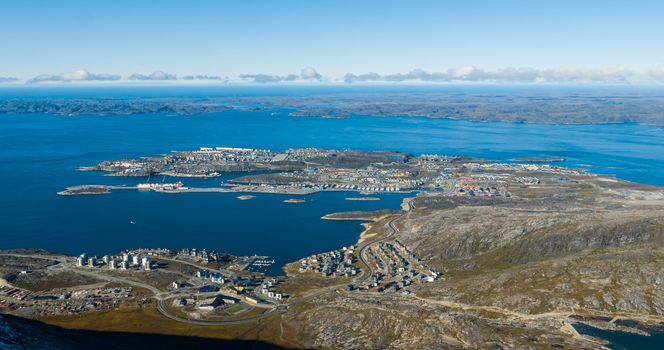 Greenlands capital Nuuk - largest city in Greenland aerial view. Drone photo of Nuuk from air, aka Godthaab seen from Mountain Sermitsiaq also showing Nuup Kangerlua fjord.