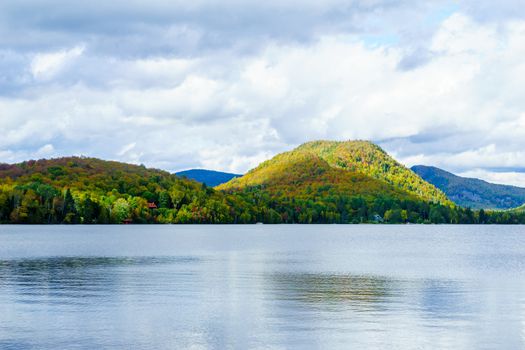View of Superior Lake, and fall foliage colors in the Laurentian Mountains, Quebec, Canada