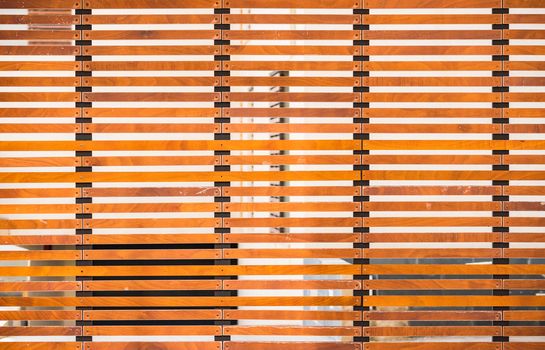 Close-up of modern metal and wooden sliding rolling door gate