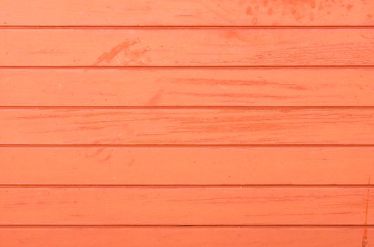 Red colored wooden planks background texture with copy space
